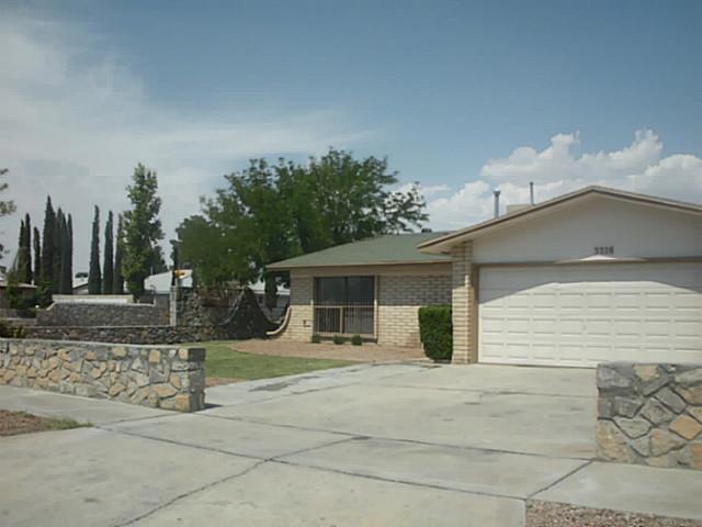 Exterior Front. Fresh landscaping on cor