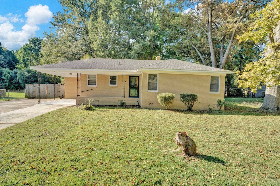 Single story home with a front lawn