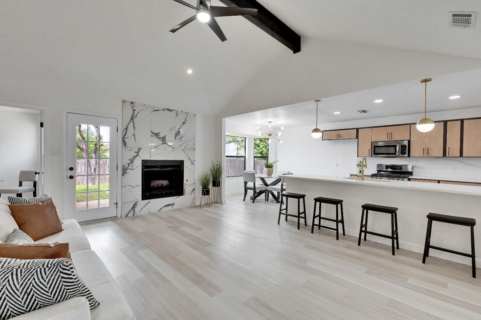 Kitchen featuring open floor plan, plenty of natu