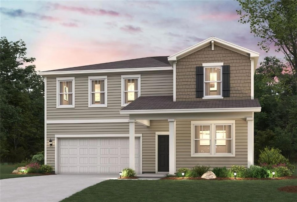 View of front of home with concrete driveway, an attached garage, and a front yard