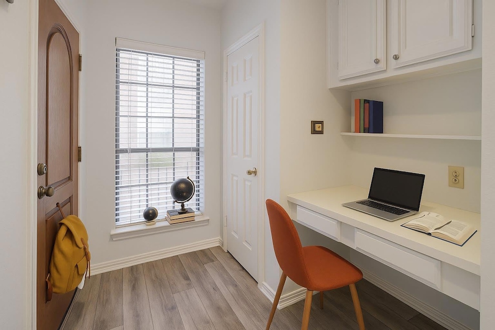 Office area featuring light wood finished floors,