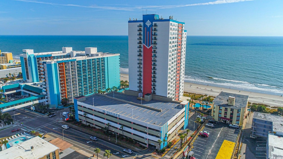Bird's eye view with a water view and a beach view