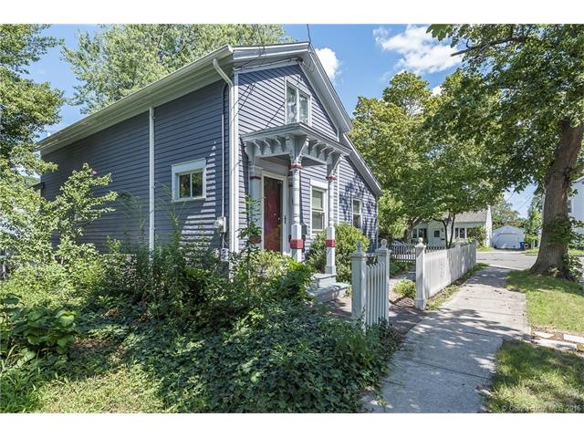 Exterior front. Corner lot cape style home in East