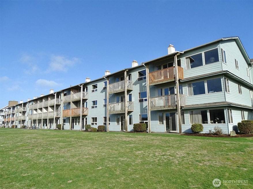 Rear of the Canterbury Inn. #303 is on the top floor, 2nd deck in from the right.