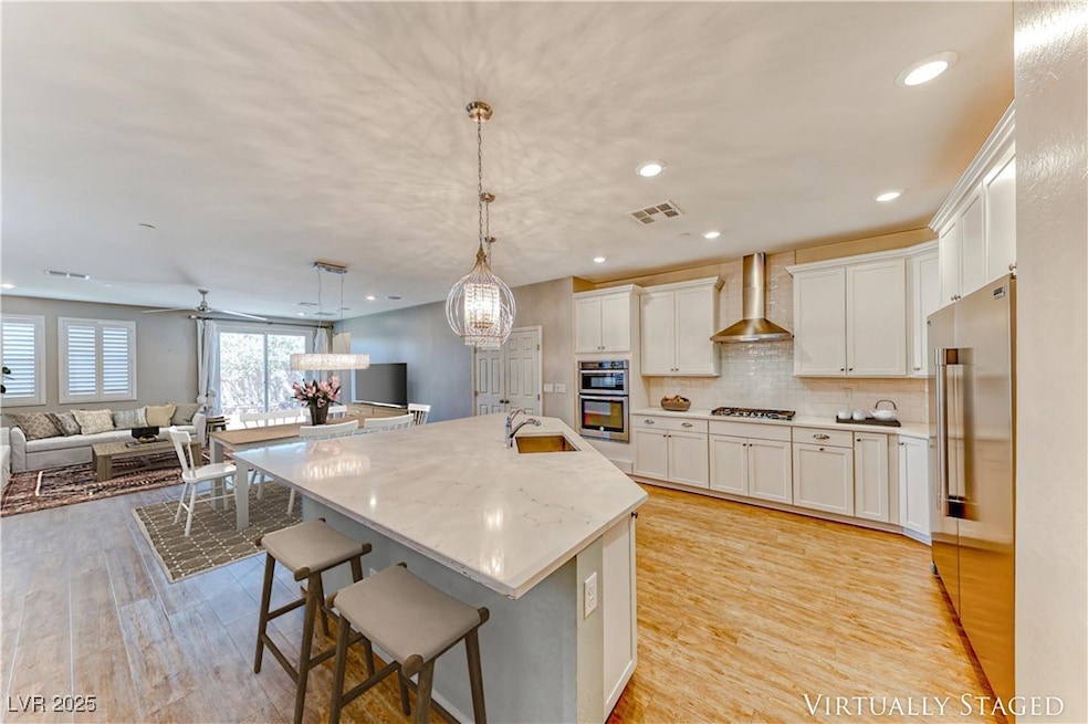 Kitchen featuring open floor plan, visible vents,