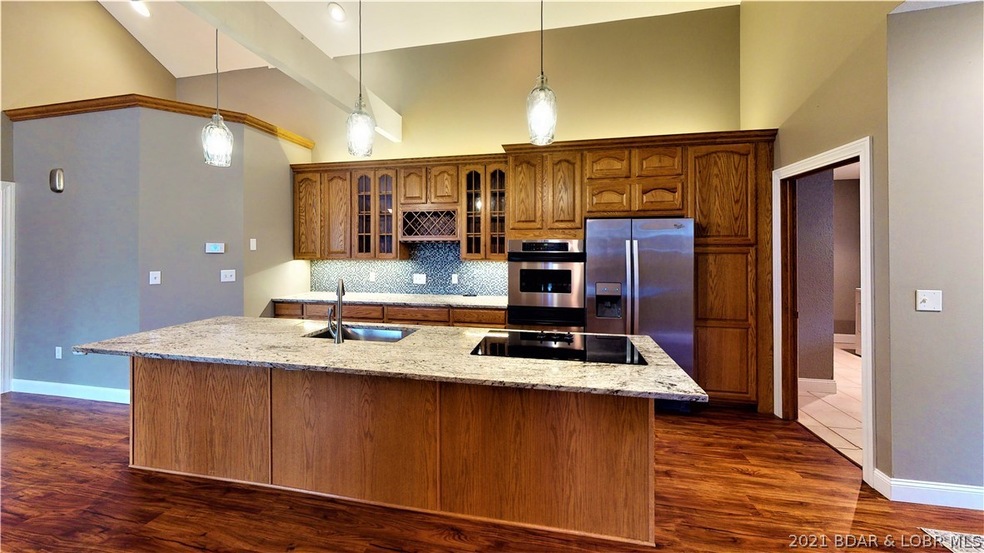 Granite counter tops with overhang for stools. Gre
