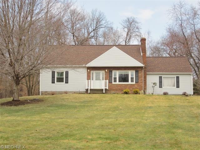 View of front of house on almost an acre of land!