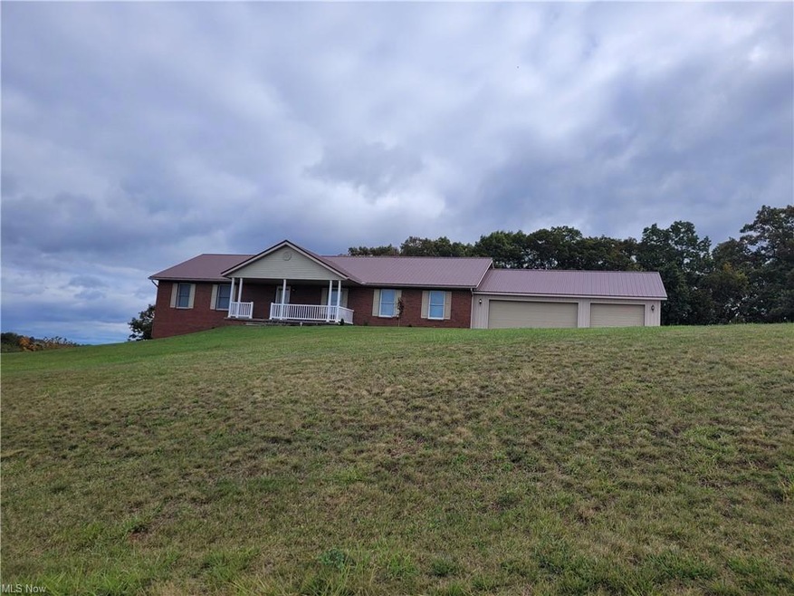 Single story home with a front lawn and a garage