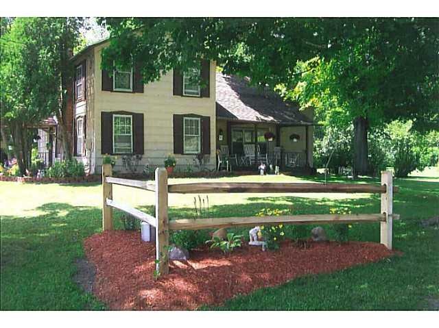 Exterior Front. A summertime view of the home with