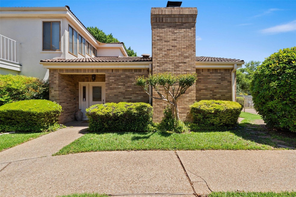 View of front of house with a chimney, brick sidi