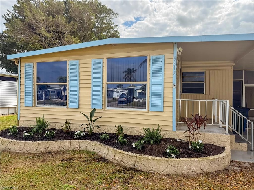 Front of the house with flowerbed