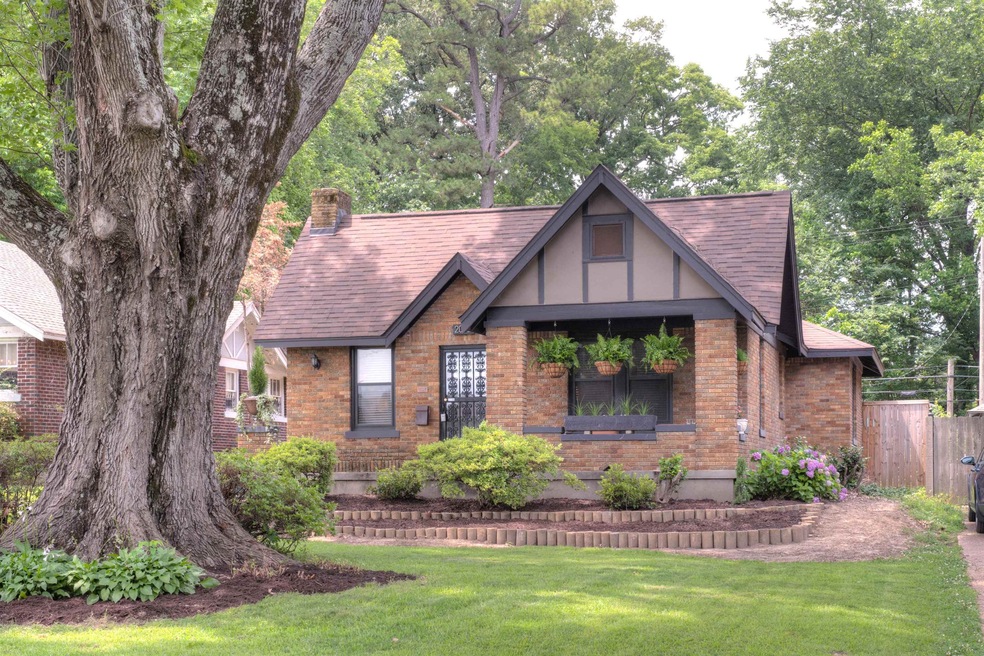 English style home featuring a front yard