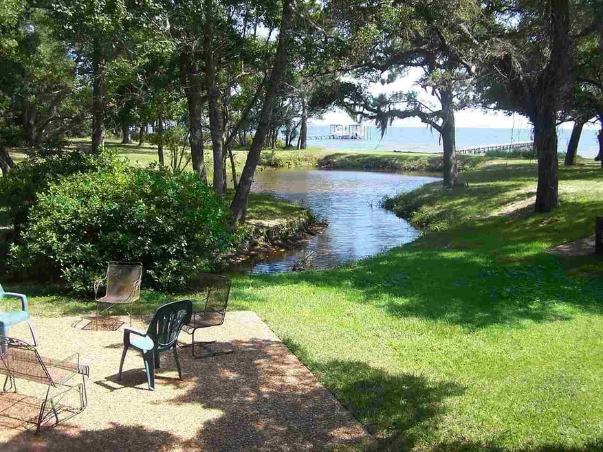 THE LOT IS TO THE LEFT OF THE POND