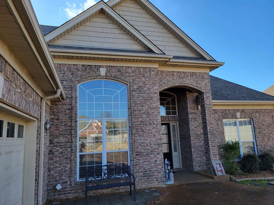 Entrance to property featuring brick siding, an at