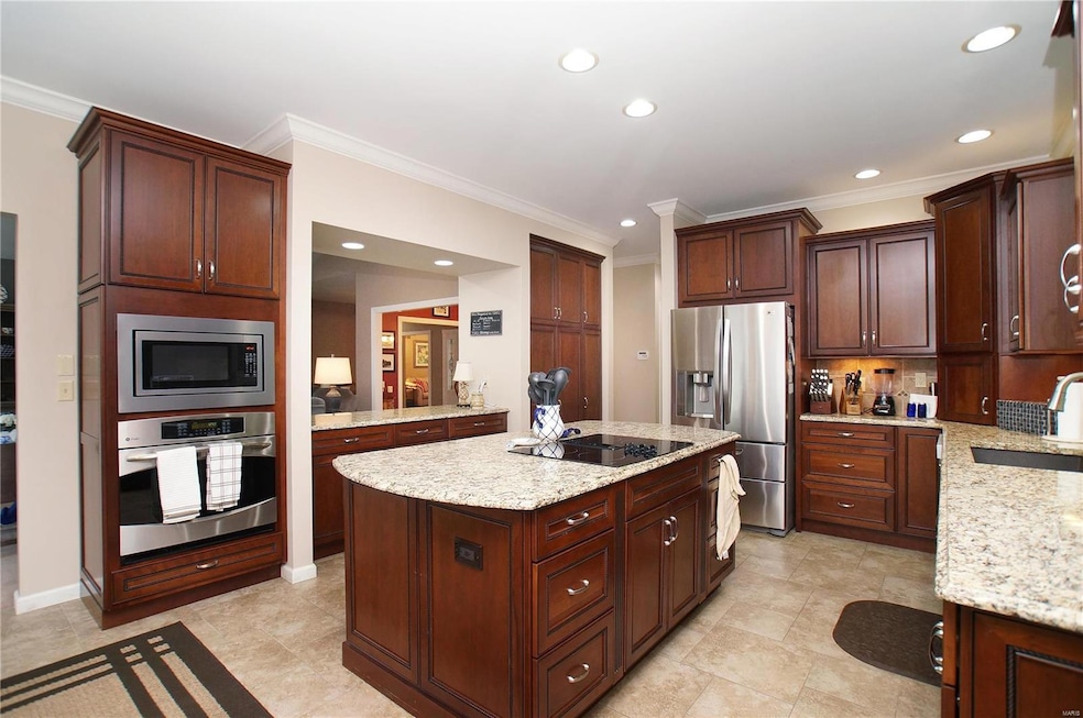 Spacious Kitchen offers custom cabinetry, plenty o