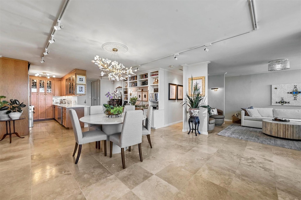 View of dining, kitchen, built in desk, and living