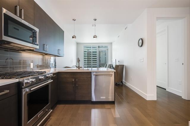 Immaculate condo with East facing city views and L