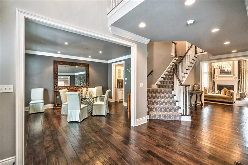 The open floor plan with scraped hardwood floors throughout.