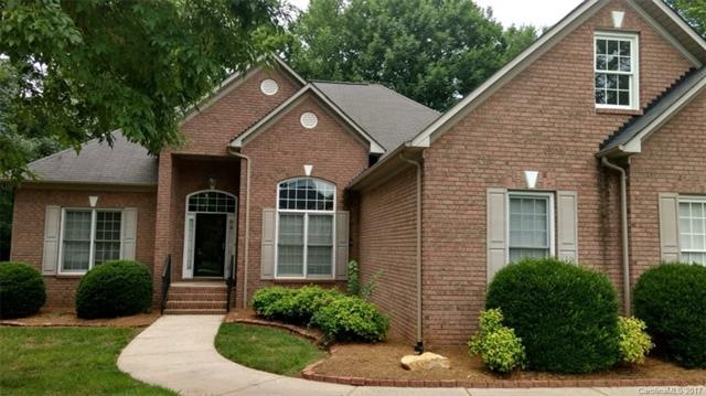 Brick front custom built home with covered porch.