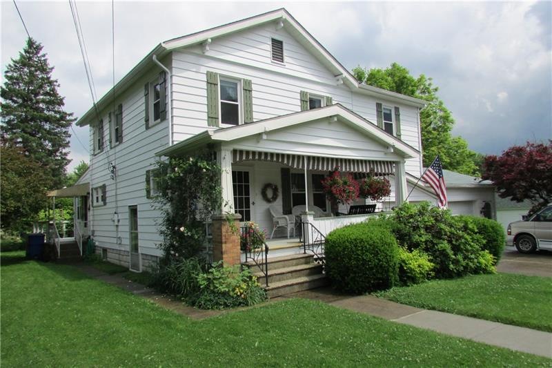 Exterior front with covered front porch 2 car gara