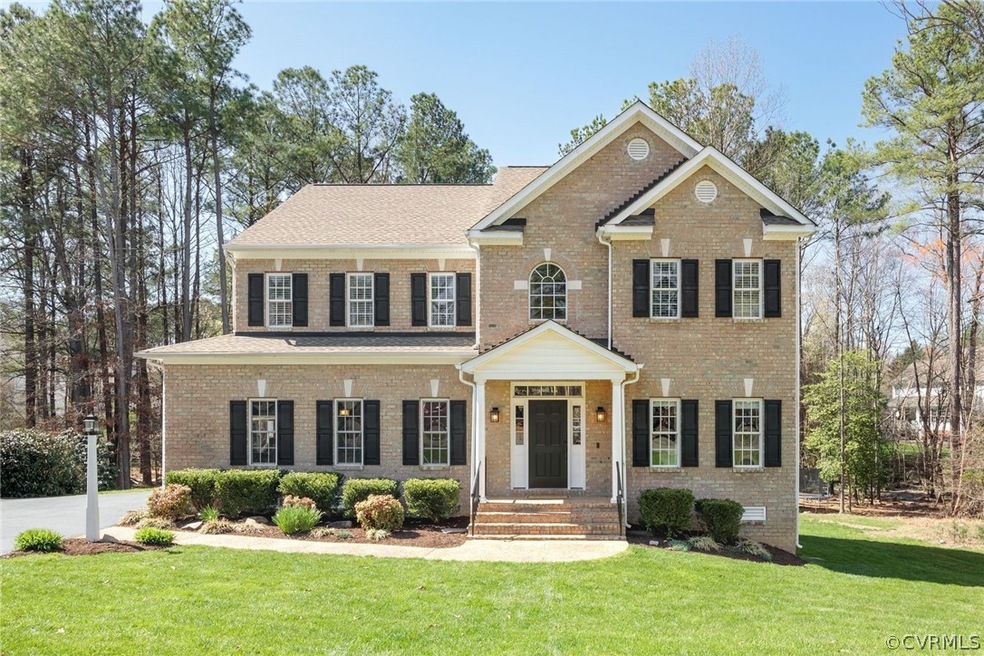 Handsome brick Transitional in desirable Wyndham Forest