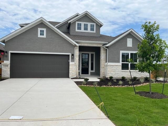 Craftsman inspired home featuring stone siding, c