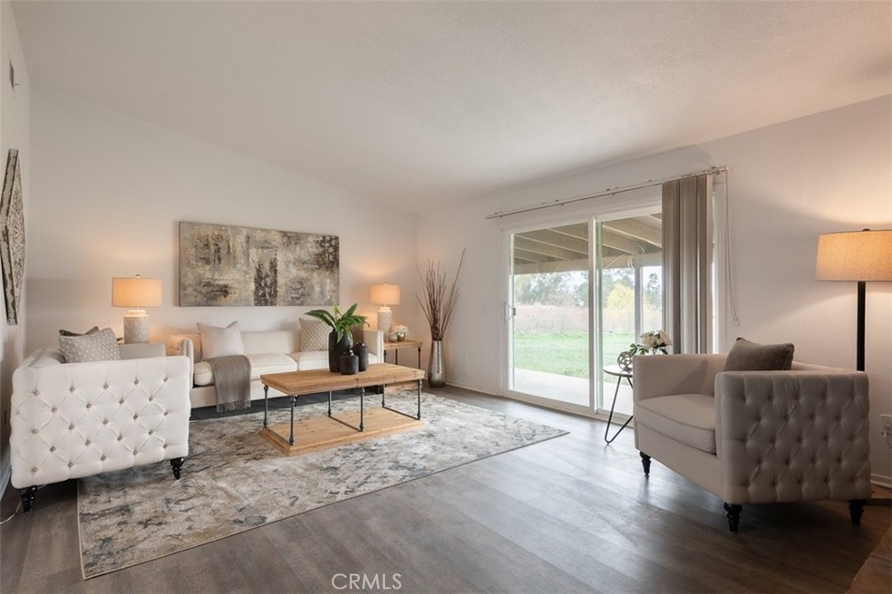 One of two living rooms that open up to the back patio and expansive acreage