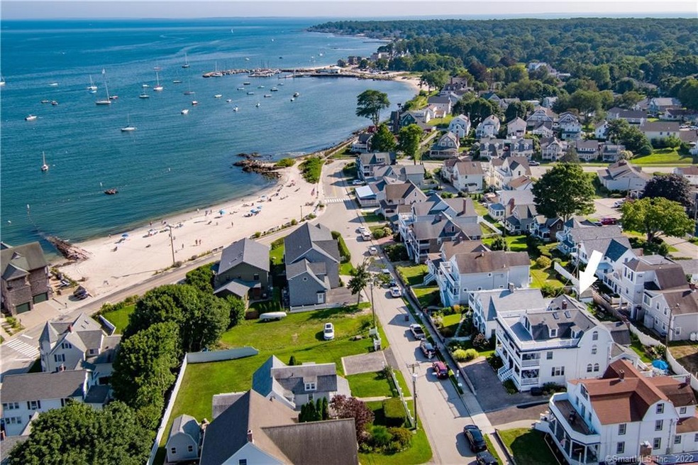 AERIAL PHOTO WITH ARROW ABOVE THE WHOLE HOUSE, DEN