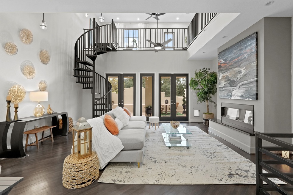 Second Level Open Concept Living Room with Tall Ce