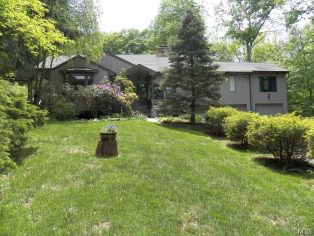 Picturesque acre setting with updated spacious int