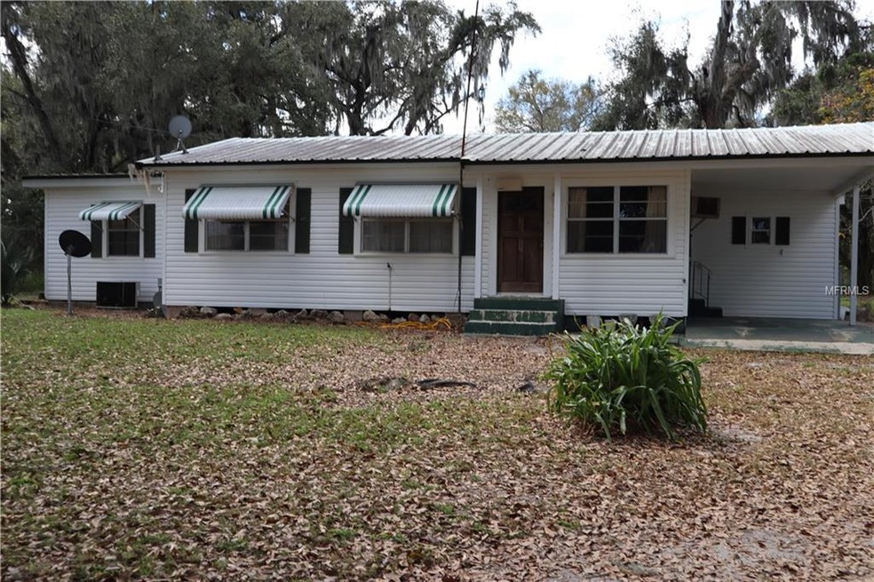 Front of the home. 1 car carport