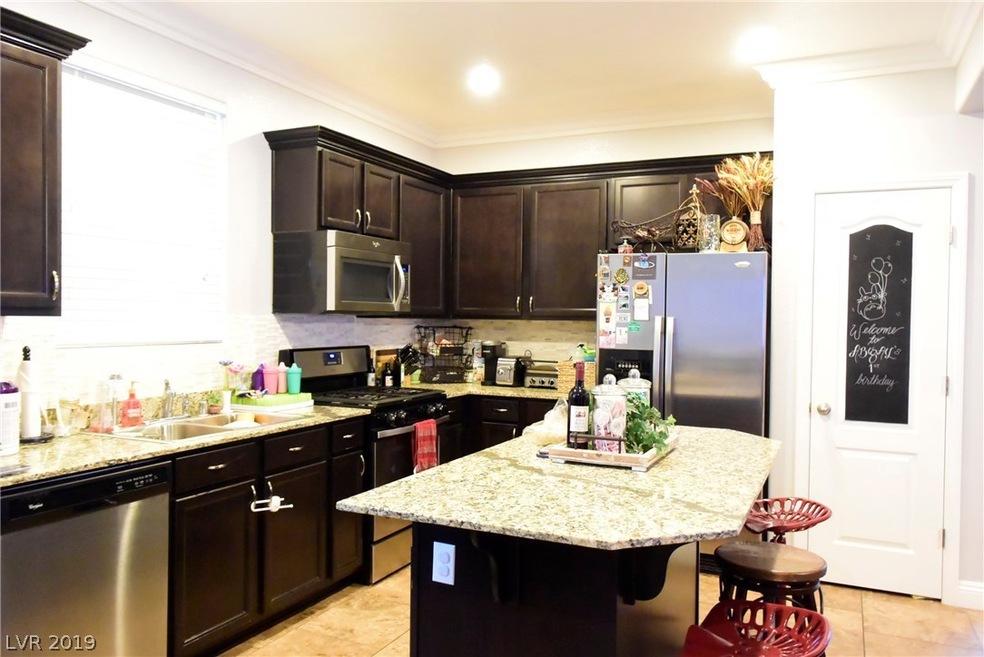 Kitchen with dark cabinets and granite counter top