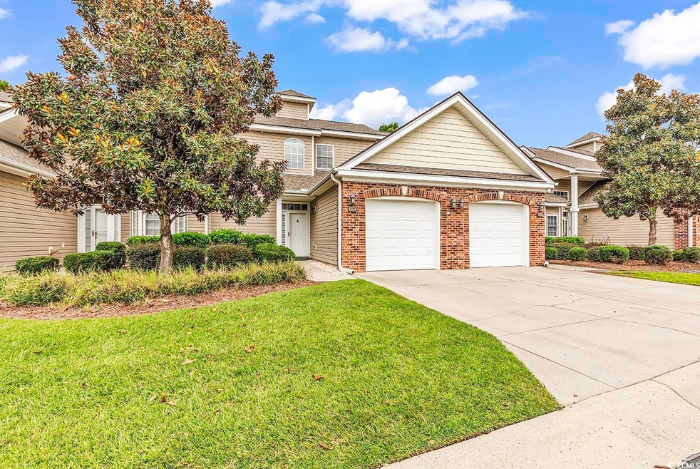 View of front of property featuring a front yard a