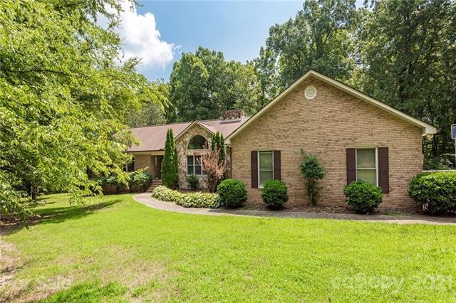 Nice one-story, partial brick home on private wood