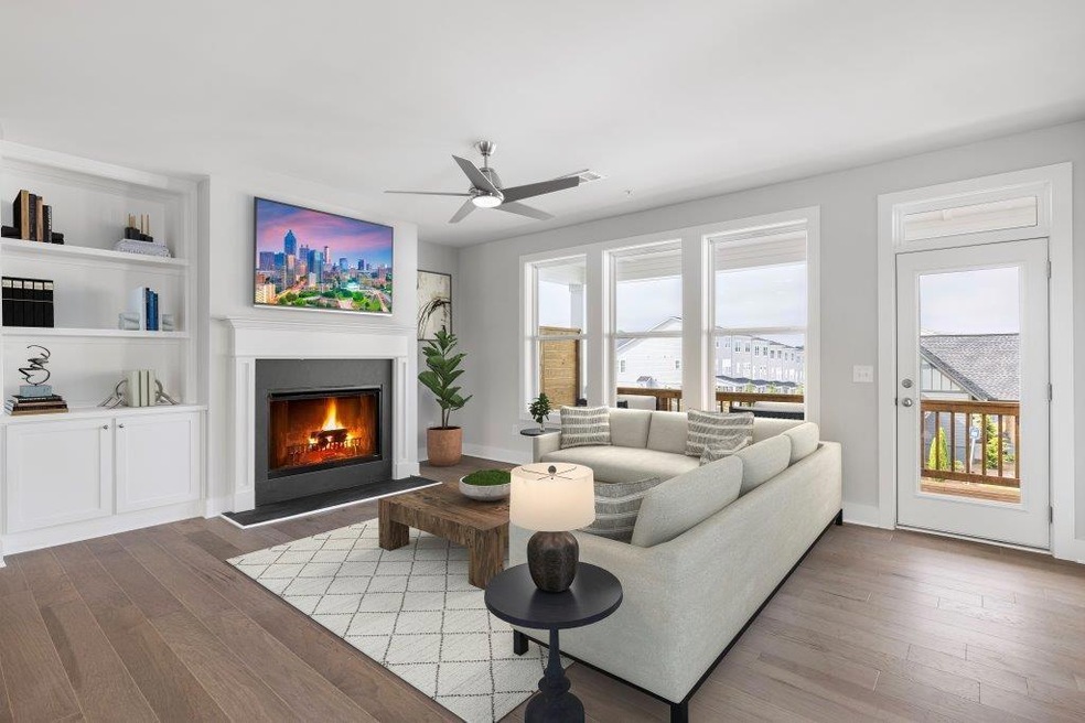 Living room with wood-type flooring and ceiling fa