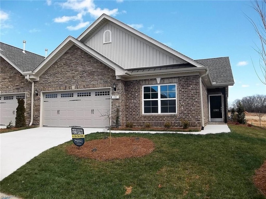 This home has a gorgeous brick and stone exterior.
