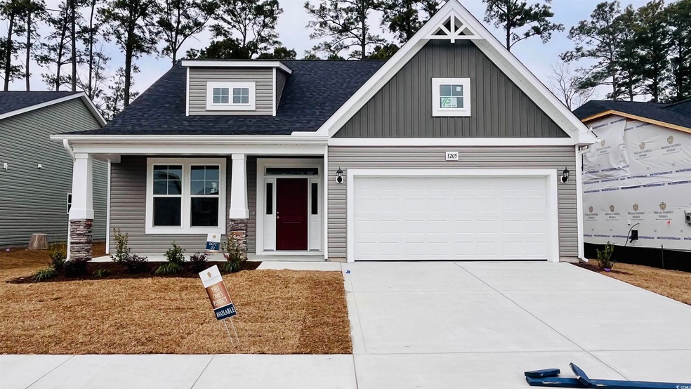 Craftsman-style home featuring a garage