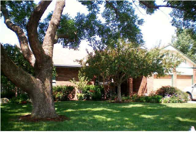 LOADS OF SHADE SURROUND THIS WONDERFUL FAMILY HOME