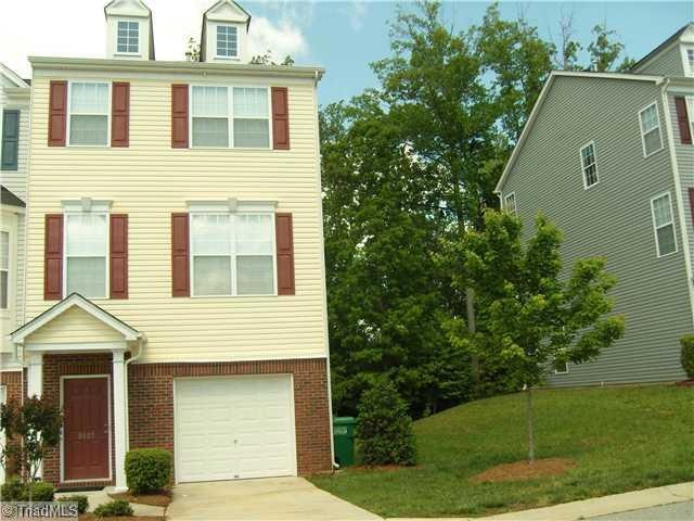 Exterior Front. Three Story Townhome~End Unit~Backs up to Private Wooded Area