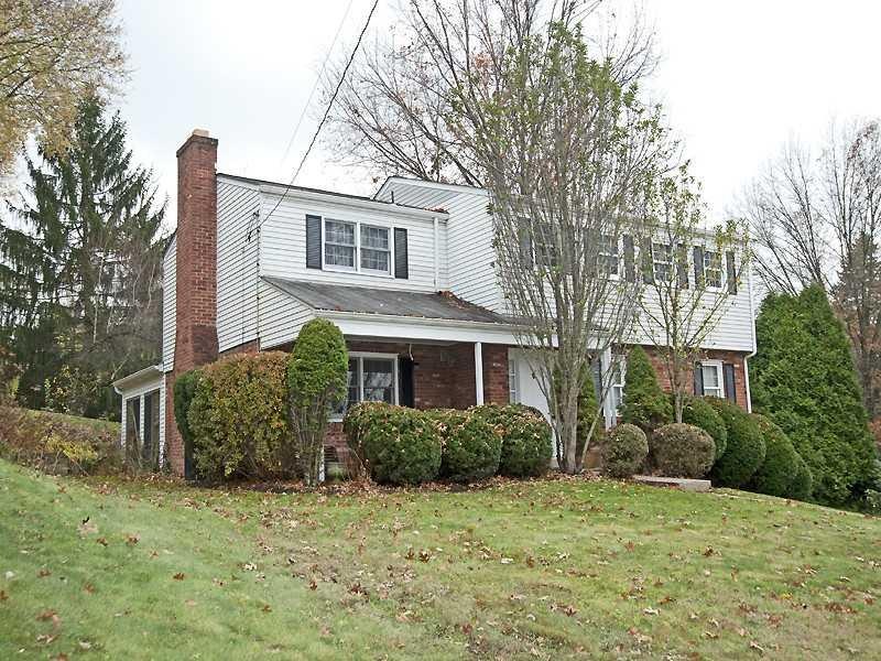 Exterior Front. Private front porch nestled betwee