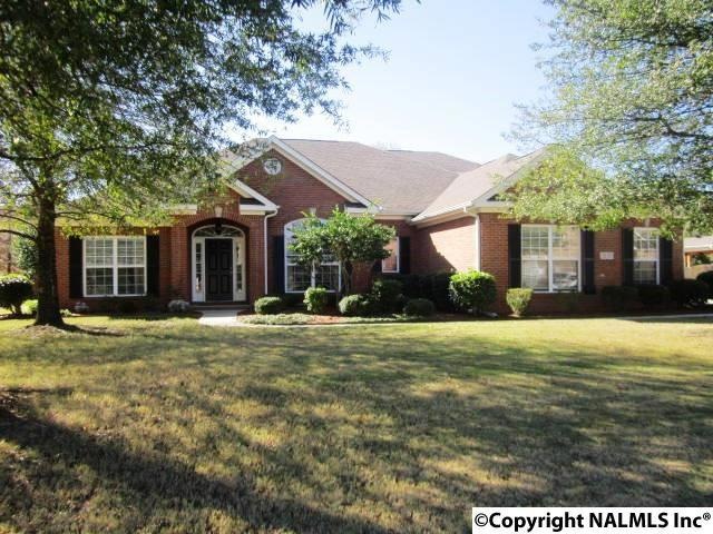 This pristine full brick rancher offers lavish landscaping, security system, sprinkler system and 3 car garage.