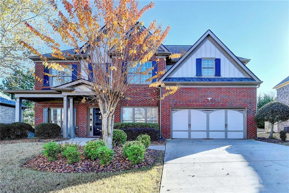 Traditional-style house with an attached garage, b