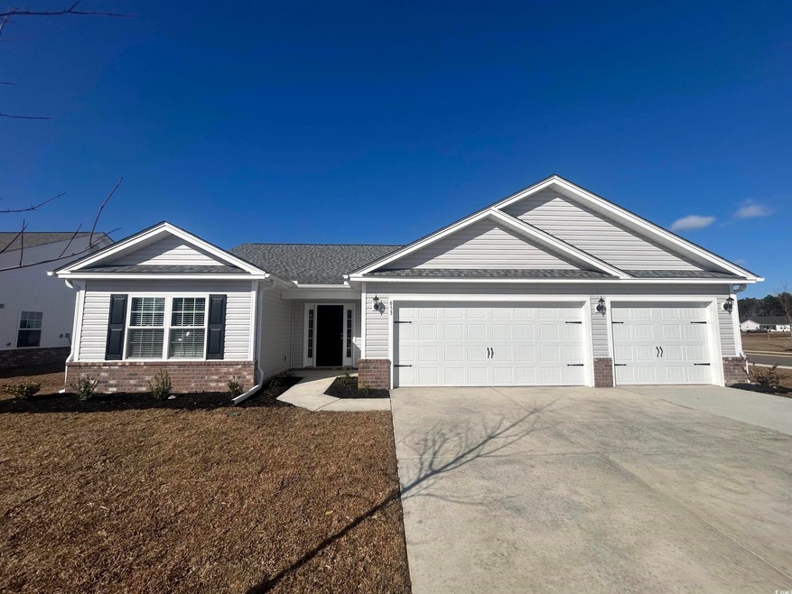 Ranch-style home with driveway, an attached garage