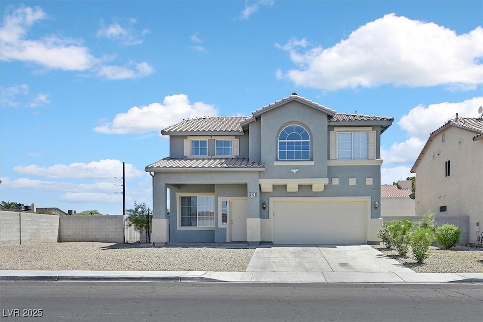 Mediterranean / spanish house with stucco siding, concrete driveway, a garage, and a tiled roof