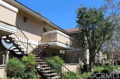 Front view of the upstairs unit with balcony