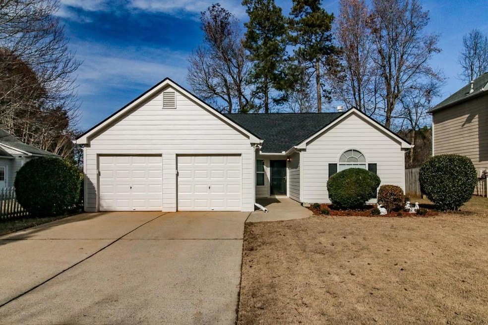 Ranch-style home with a garage