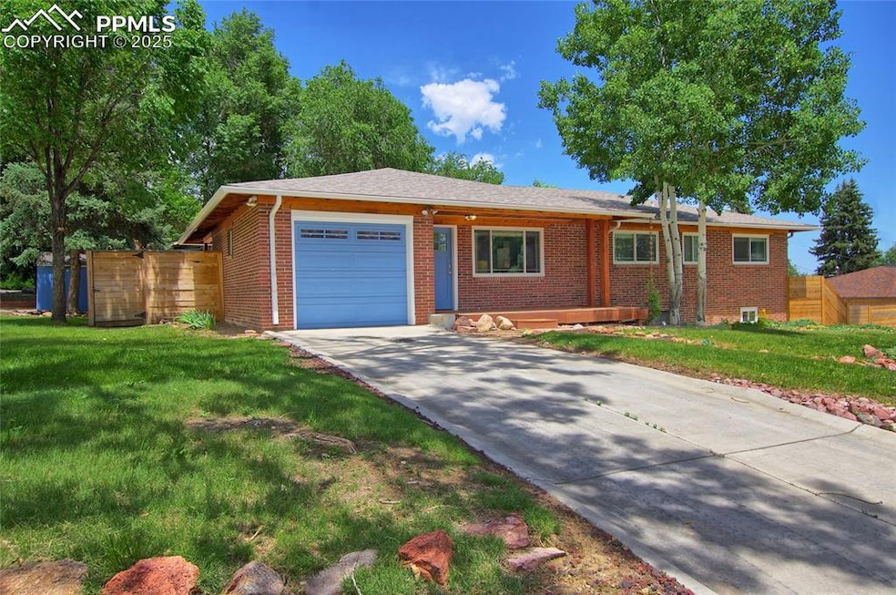 Ranch-style house featuring an attached garage, brick siding, and concrete driveway