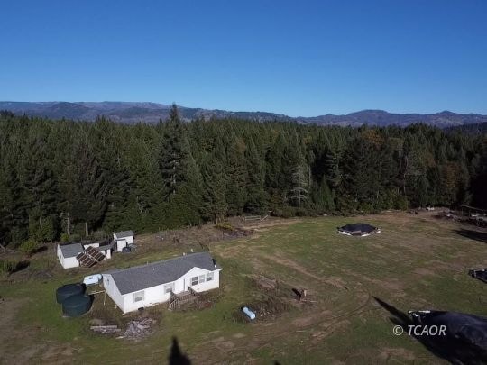Aerial of house & meadow