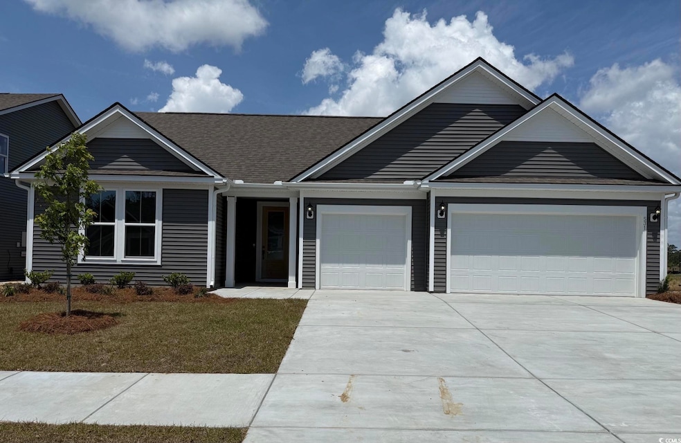Ranch-style home with a garage, a front lawn, a sh