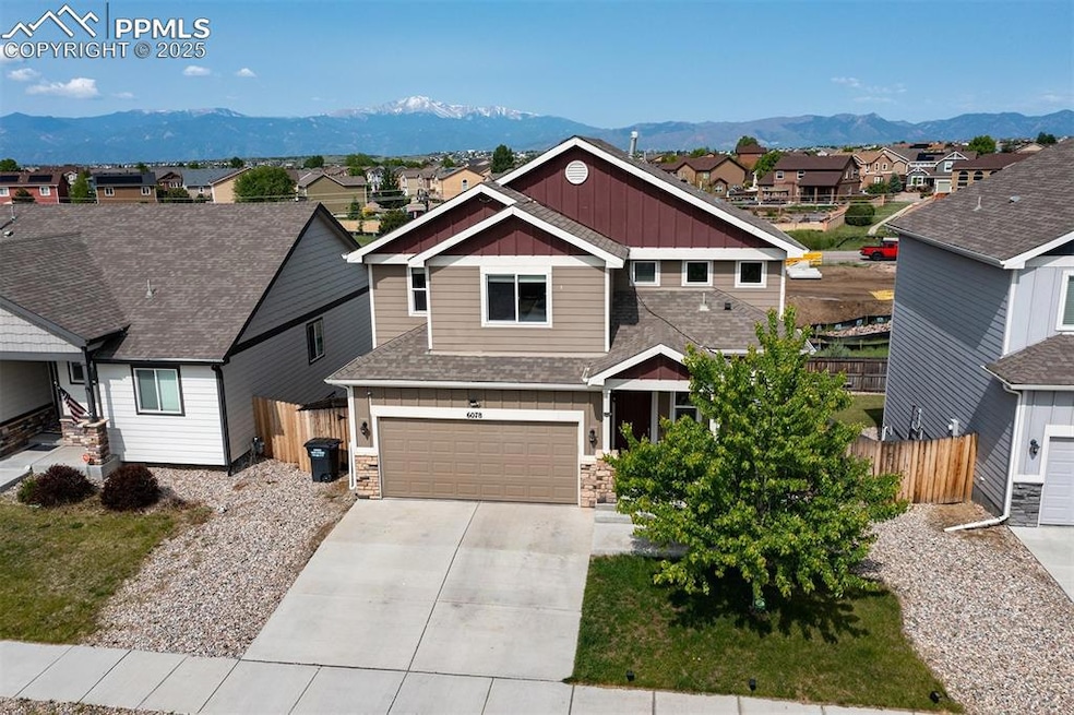 Craftsman-style house featuring board and batten siding and a mountain view